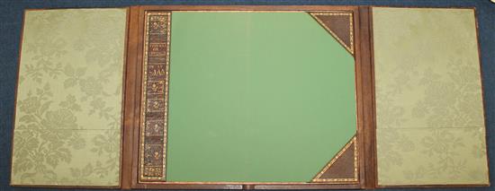 A French gilt tooled and brown leather double folding desk blotter, W.1ft 8in.